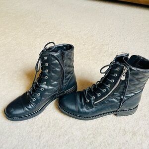 Black combat boots w/quilted design and zippers. Worn,maybe once or not at all.